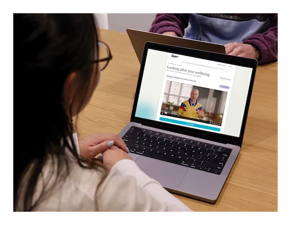 A staff member working through an online learning series module