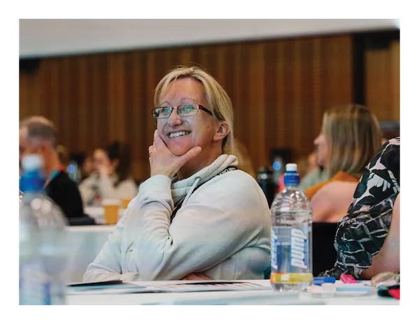 Participants smiling during a Resilience Project wellbeing workshop
